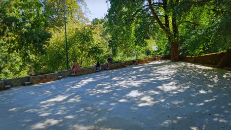 Tourists-resting-under-shade-of-trees.-Sintra,-Portugal