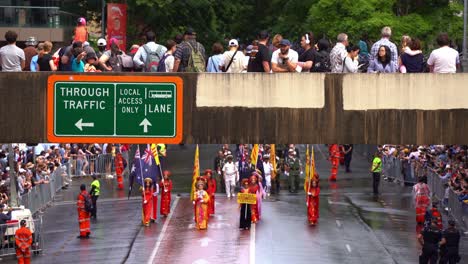 Anzac-Day-parade,-Vietnam-veterans-and-their-families-marching-down-Adelaide-street-with-crowds-gathered-alongside,-honouring-the-memory-of-those-who-served,-Brisbane-city