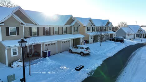 Row-of-american-houses-during-snowflakes-in-winter