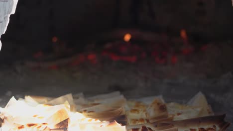 Cooking-bread-in-clay-oven-traditional-bakery-of-pastry-in-slow-motion