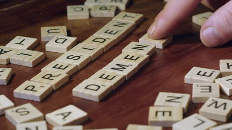 Narrow-focus-close-up:-Words-PRESIDENT-and-DEMENTIA-in-Scrabble-tiles