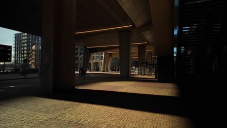 Chiaroscuro-light-at-modern-Amsterdam-Metro-Noord-overpass-bridge-with-light-dark-and-contrast