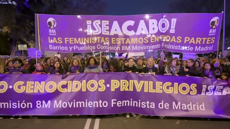 Female-protesters-jump-energetically-during-a-demonstration-on-International-Women's-Day