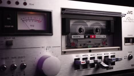 Old-Audio-Tape-Player-and-Cassette-Tape-Rolling-on-Playback,-Close-Up