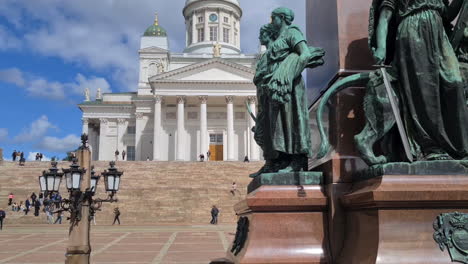 Helsinki-Cathedral-and-Sculptures-on-Senate-Square-on-Sunny-Day,-Finland