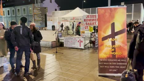 Christian-missionaries-talk-to-people-on-street-in-Stockholm-at-night