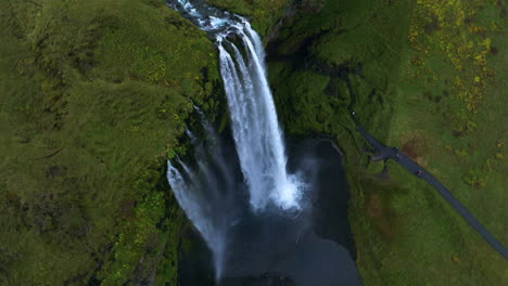 Seljalands-River-Flowing-Through-The-Seljalandsfoss-Waterfall-In-Iceland