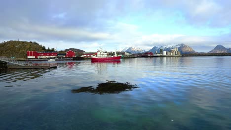 The-fishing-boat-leaves-the-harbor-and-the-bay-behind-the-breakwater