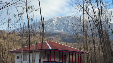 Snow-covered-mountain-in-background-of-scenic-vivid-wonderful-landscape-of-rural-village-house-building-traditional-architecture-design-forest-climate-nature-middle-east-local-people-life-agriculture