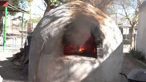 Cooking-bread-in-clay-oven-traditional-bakery-of-pastry-in-slow-motion