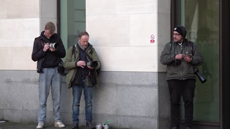 Three-Paparazzi-wait-outside-the-Westminster-Magistrate-Court-to-photograph-Tommy-Robinson