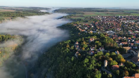 Foggy-Tauber-River-in-Rothenburg-ob-der-Tauber,-Bavaria,-Germany---Aerial-4k