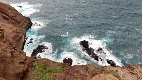 Top-down-view-waves-crashing-into-Rocky-coastline-from-Ponta-de-São-Lourenço-in-Madeira-Island