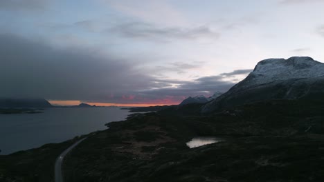 Twilight-hues-over-Austnesfjorden,-snow-capped-mountains,-Lofoten,-Norway,-serene-arctic-landscape