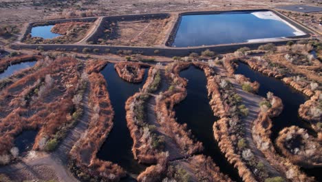 Aerial-View-of-Sedona-Wetlands-Preserve,-Sewage-Wastewater-Treatment-Facility-by-Arizona-89a-State-Route-Freeway