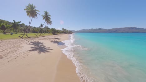 FPV-drone-flight-over-idyllic-Caribbean-paradise-beach-Playa-Colorada,-Samana