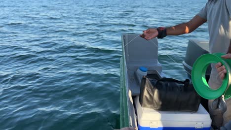 fisherman-try-to-fishing-activity-on-sea-in-boat-traditional-fishing-skill-in-Iran-Arabian-culture-coastal-beach-landscape-of-local-people-wide-panoramic-view-of-ocean-horizon-hunting-concept-travel