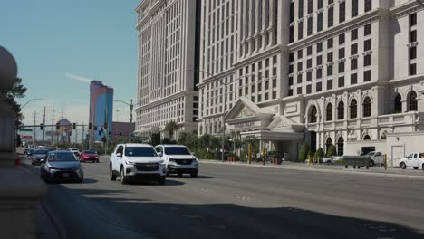 Traffic-Driving-Past-Along-The-Strip-In-Las-Vegas