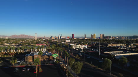 Las-Vegas-NV-USA,-Downtown-and-Strip-Cityscape-Skyline-From-West-Side-and-Traffic-on-Sahara-Avenue,-Aerial-View