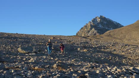 Two-Women-Hike-With-Trekking-Poles-Near-Elfin-Lakes-Trails-In-Garibaldi-Provincial-Park,-BC-Canada