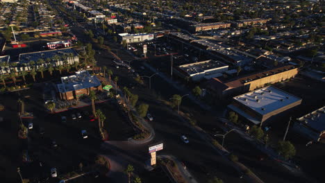 Las-Vegas-USA,-Revealing-Drone-Shot-of-Cityscape-Skyline-and-Sahara-Avenue-Traffic-on-Golden-Hour