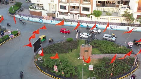 AERIAL-DRONE-VIEW-A-lot-of-joy-is-seen-from-his-elder-son-walking-through-the-circle-and-a-lot-of-flags-are-also-seen-flying-around
