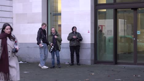 Three-Paparazzi-wait-outside-the-Westminster-Magistrate-Court-to-photograph-Tommy-Robinson