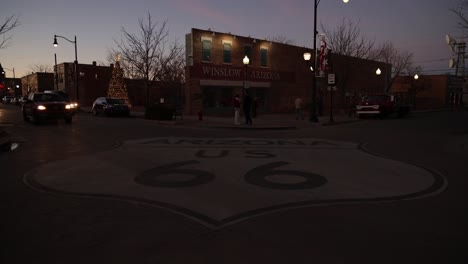 Time-lapse-video-of-intersection-in-Winslow,-Arizona-with-vehicles-and-pedestrians