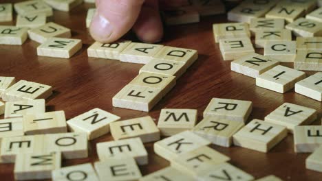 Scrabble-tiles-added-to-word-FOOD-to-make-crossword-of-GMO,-FOOD,-BAD