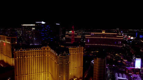 Las-Vegas-Strip-Buildings-at-Night,-Aerial-View-of-Hotel-Casino-Resorts-in-Lights,-Paris,-Bellagio,-Cosmopolitan