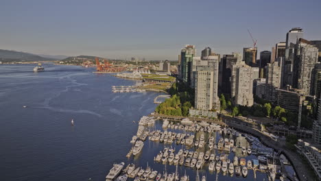 Vancouver-BC-Canada-Aerial-v43-drone-fly-along-waterfront-promenade-capturing-harbour-views-downtown-cityscape,-bayshore-marina-and-Eastside-shipyard---Shot-with-Mavic-3-Pro-Cine---July-2023