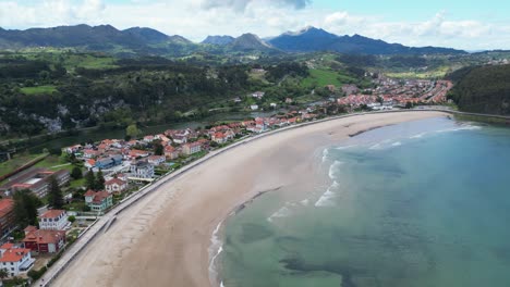 Ribadesella-Beach-and-Coastal-Town-in-Asturias,-Costa-Verde,-North-Spain---Aerial-4k