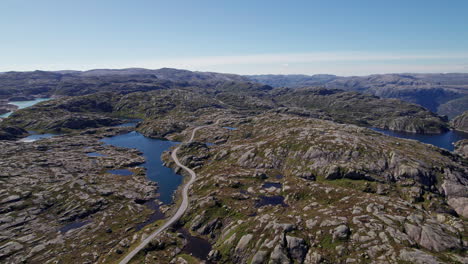 Aerial-shot-over-the-rocky,-mossy-landscape-of-Rogaland,-Norway