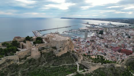 Alicante-Castle,-City-and-Port-at-Costa-Blanca,-Spain---Aerial-4k-Circling