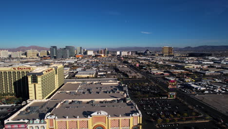 Las-Vegas-USA,-Drone-Shot-of-Cityscape-Skyline,-Tropicana-Avenue-Traffic-and-Strip-Hotels-and-Casinos-in-Background