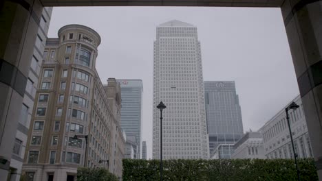 Framed-cityscape-with-modern-skyscrapers-and-classic-architecture,-overcast-sky