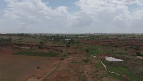 Aerial-panorama-of-rocky-landscape-with-mining-pits-and-pond-in-Plateau,Nigeria
