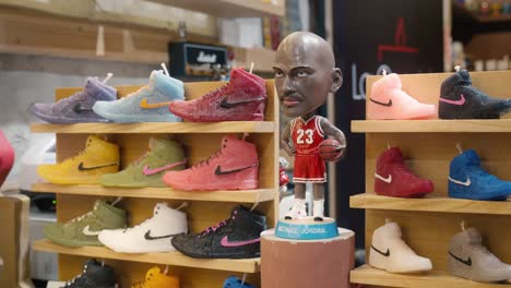 Sports-themed-candle-collection-with-iconic-sneaker-designs,-La-Candela-store,-Venice