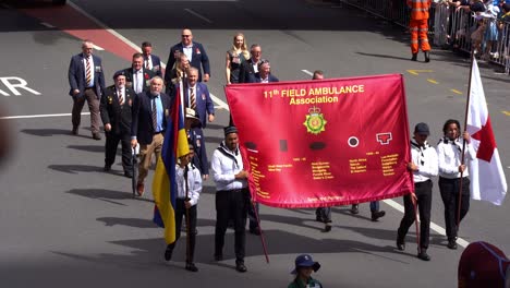 The-11th-Field-Ambulance-Association,-medical-support-during-war-times,-representatives-marching-down-the-street-during-Anzac-Day,-Brisbane,-Australia