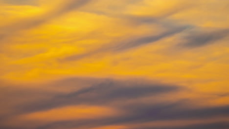 Moving-giant-clouds-formation-during-golden-hour-sunset-sunrise-time-lapse