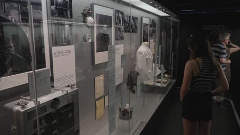 Caucasian-lady-walking-admiring-historical-exhibit-at-Zeppelin-Muesum-in-Germany