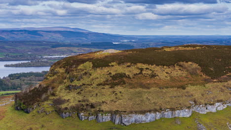 Timelapse-of-rural-nature-rocky-hillside-valley-with-lake-in-distance-during-sunny-cloudy-day-viewed-from-Carrowkeel-in-county-Sligo-in-Ireland