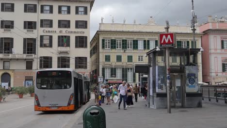 Tram-pausing-at-a-metro-stop-in-Piazza-De-Ferrari-in-Genoa,-Italy