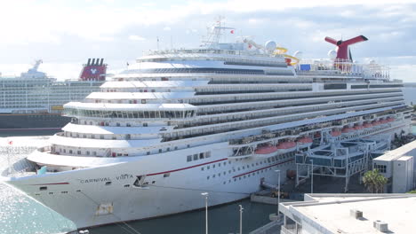 Witness-the-grandeur-of-cruise-ship-travel-as-Carnival-Cruise-ship-awaits-tourists-at-the-terminal-cruise-port,-ready-to-set-sail-on-an-extraordinary-voyage-in-this-mesmerizing-video-background