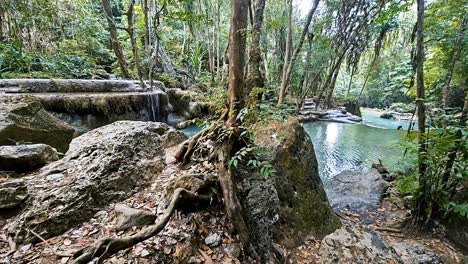 Jungle-waterfall-pools-in-Erawan-National-Park,-serene-natural-setting-with-cascades-and-lush-foliage