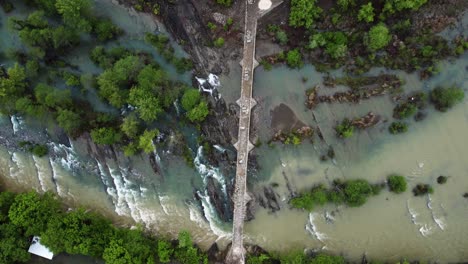 An-aerial-shot-of-an-old-bridge-capturing-its-historical-charm-and-scenic-beauty