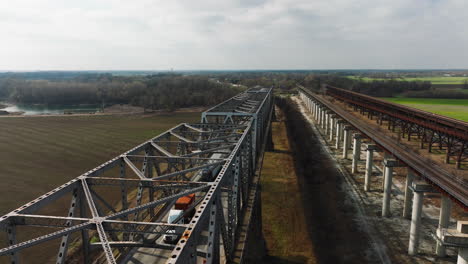 Parallel-train-tracks-at-west-memphis-delta-regional-river-park,-tennessee,-daytime,-aerial-view