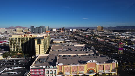Las-Vegas-USA,-Drone-Shot-of-The-Orleans-Hotel-and-Casino,-Strip-in-Skyline-and-Traffic-on-Tropicana-Avenue