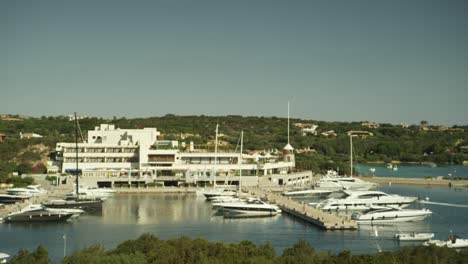 Landscape-view-of-a-luxury-yacht-seaside-resort-in-Costa-Smeralda,-Italy,-on-a-sunny-day