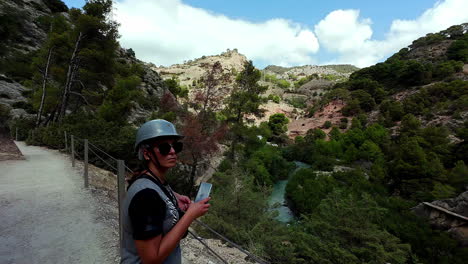 Woman-hiker-with-protective-helmet-on-at-beautiful-nature-trail-south-Spain